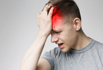 Fototapeta premium Headache Pain. Millennial man having painful migraine