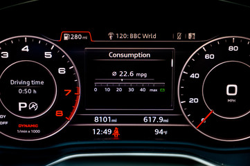 Fuel consumption display in instrument cluster of modern car.  Fuel economy is one of the most important factors to consider when buying a new car. Car gas mileage theme, fuel consumption concept