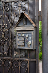 iron mail box for letters and newspapers and correspondence with metal patterns and elements