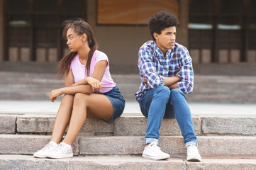 Fototapeta na wymiar Relationship problem. Black teenage couple separate after argument