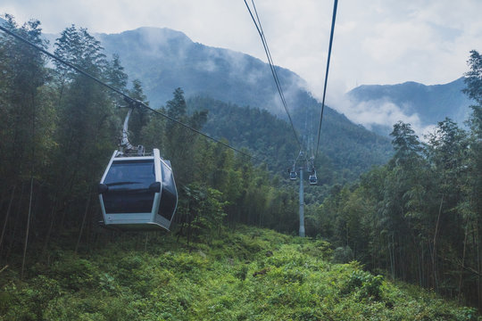 Cable cars on Mingyue Mountain, Jiangxi, China - Powered by Adobe