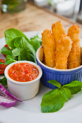 Deep fried battered Mozzarella sticks with tasty homemade spicy chilli sauce dip  -  Sriracha.