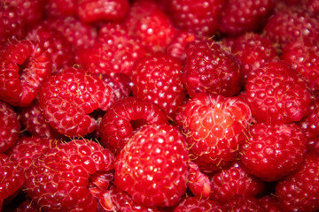 Fresh raw organic raspberries on a plate