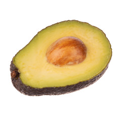 half of black avocado with stone isolated on white background
