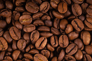 fresh brown coffee beans background. top view