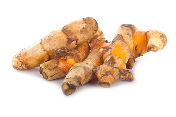 heap of turmeric slices isolated on white background
