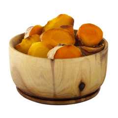 heap of turmeric in wooden cup isolated on white background