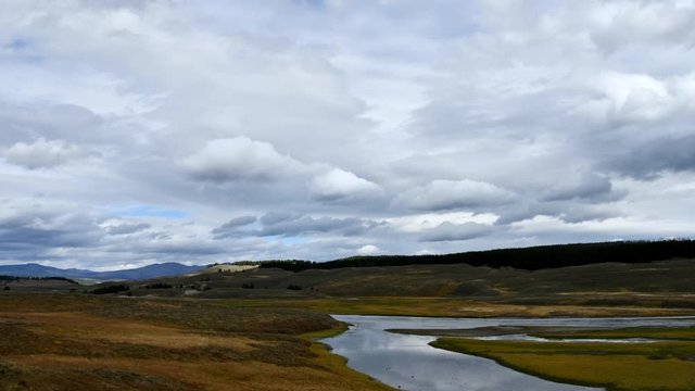 Timelapse of clouds over the Yellowstone River as it ambles through the Hayden Valley, Yellowstone National Park, Wyoming. Camera Fixed.