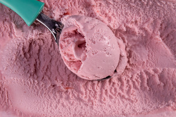 Strawberry ice cream with scoop