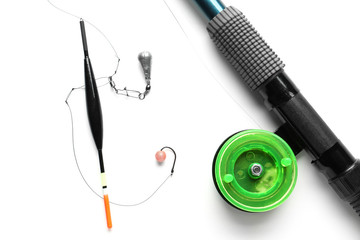 Fishing tackle and tools on white background
