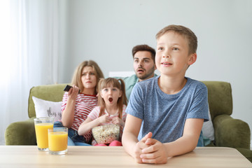 Obraz na płótnie Canvas Family watching TV at home