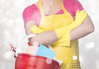 Woman in Apron with Bucket of Cleaning Supplies - Isolated