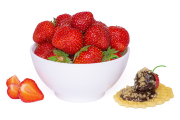 Ripe fresh red strawberries, berry on homemade wafer decorated with walnuts and chocolate