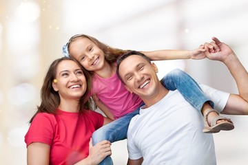 Happy cheerful family on background