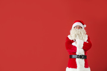 Portrait of Santa Claus on color background