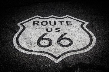 Sign of the Route 66 on the ashpalt of the mother road