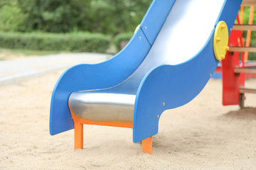 Fototapeta na wymiar Slide on playground in park