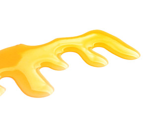 Spilled honey on white background