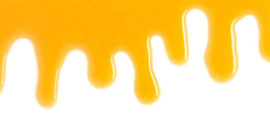 Spilled honey on white background