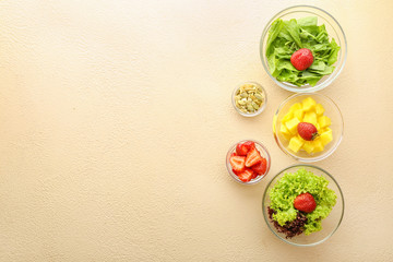 Ingredients for fresh tasty salad on color background