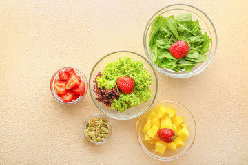 Ingredients for fresh tasty salad on color background