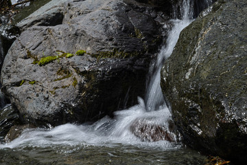 streams of water flowing among rocks 2