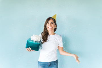 Excited Woman Enjoying In Birthday Celebration With a Gift