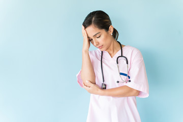Stressed Professional Wearing Scrubs In Studio