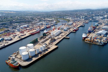Aerial view of Aberdeen harbour ships with oil & gas tanks and sea vessels