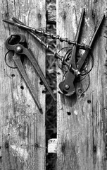 Joiner and hoe tools on a wooden background. Vintage instruments in retro style. Black and white photo.