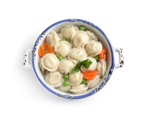 Bowl of tasty dumplings in broth isolated on white, top view