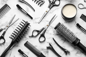 Fototapeten Flat lay composition with scissors and other hairdresser's accessories on white marble background © New Africa