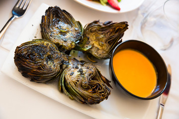 Grilled artichokes with romesco