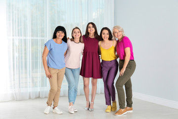 Fototapeta premium Group of ladies near window indoors. Women power concept