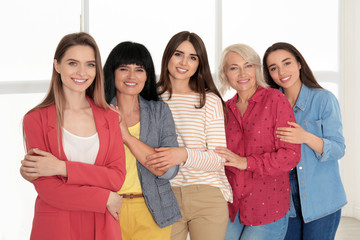 Group of ladies near window indoors. Women power concept