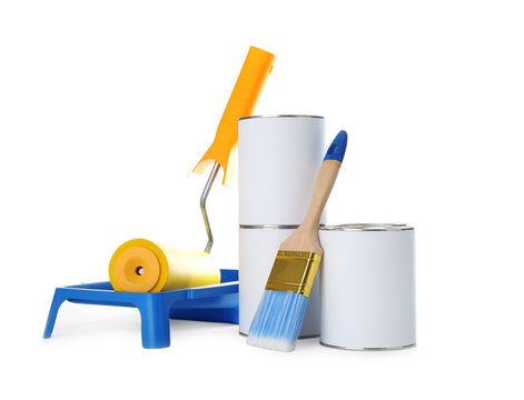 Closed blank cans of paint with brush, roller and tray isolated on white