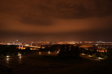 Beautiful view of bridge with illumination in modern city at night