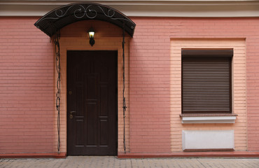 Facade of building with closed door and window