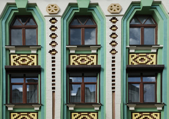 Wall of vintage building with beautiful windows