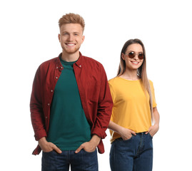 Young couple wearing blank t-shirts isolated on white. Mockup for design