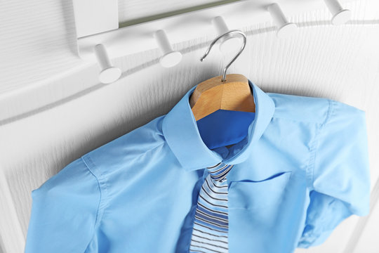 Shirt With Tie On Hanger Indoors, Above View. School Uniform