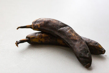 A rotten banana on a white background, pop art.
