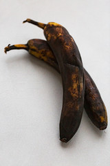 A rotten banana on a white background, pop art.