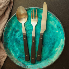 cutlery rustic, used for eating or serving (fork, knife, spoon, plate - set). food background. copy...