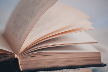 Open old book closeup. Wisdom concept. Selective focus.