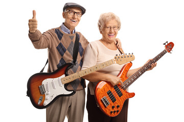 Senior man and woman with electric guitars
