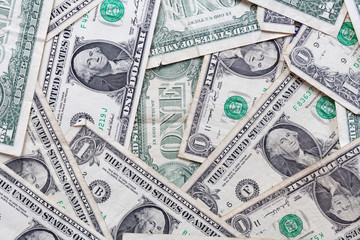 Many overlapping one dollar bills close up macro background