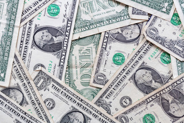 Many overlapping one dollar bills close up macro background