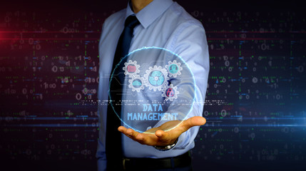 Businessman with data management hologram