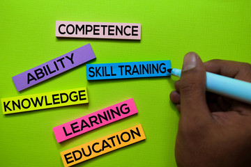 Skill Training, Competence, Ability, Knowledge, Learning, Education text on sticky notes isolated on green desk. Mechanism Strategy Concept